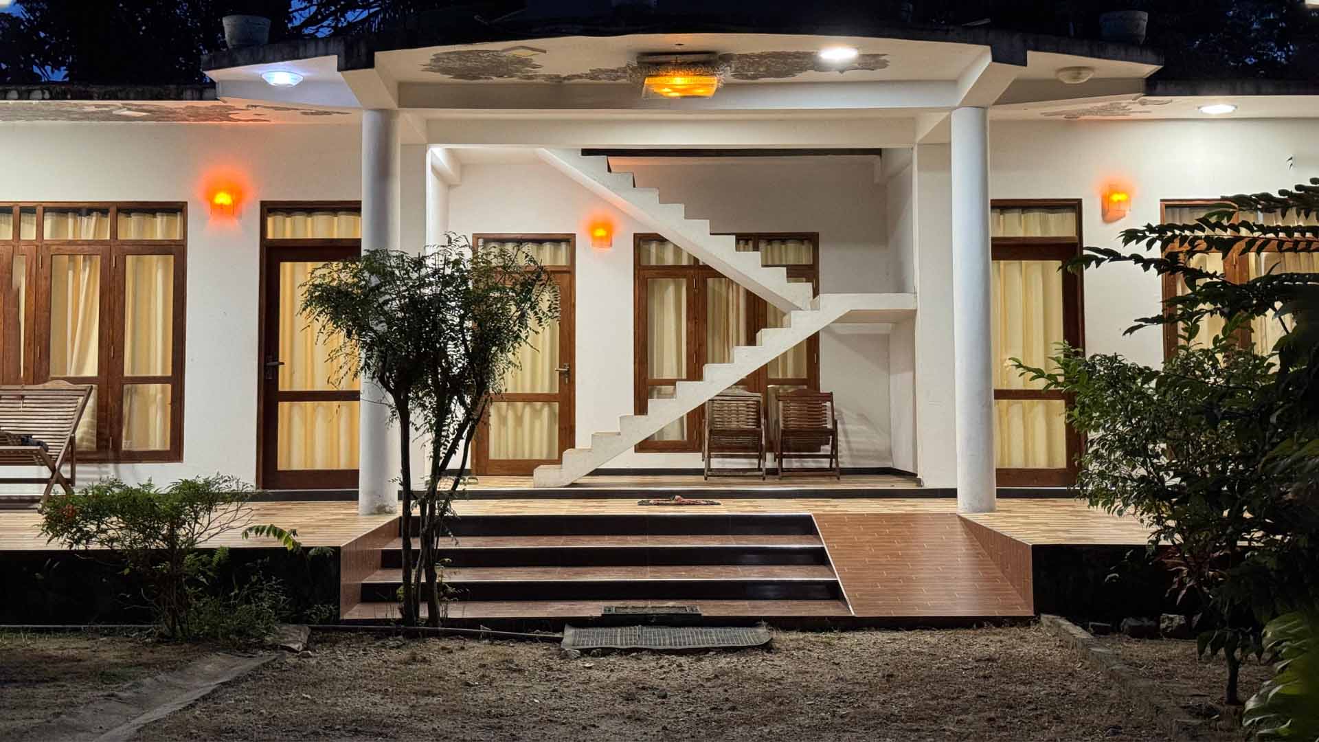 Scenic balcony view from Udawalawe Elegarden Hotel room overlooking nature